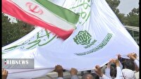 اهتزار پرچم حرم حضرت علی(ع) در گلزار شهدای علی ابن جعفر قم